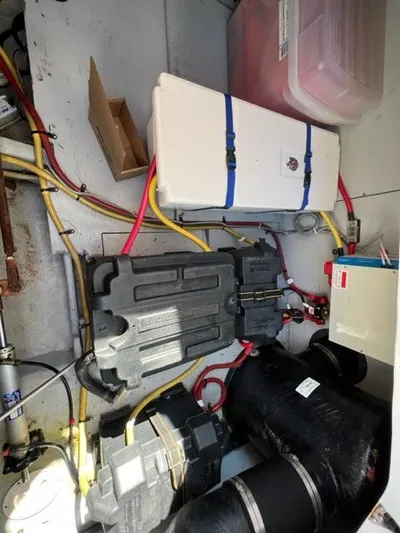 Her Idea Yacht Photos Pics Engine compartment of a 2005 Meridian 381 boat with various components and wiring.