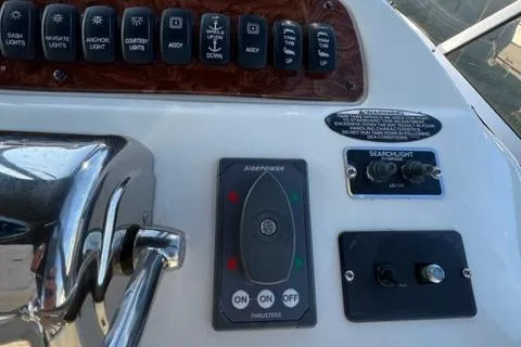 Her Idea Yacht Photos Pics Control panel of a 2005 Meridian 381 boat with various switches and thruster controls.