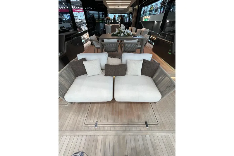  Yacht Photos Pics Luxurious interior of 2022 Explorer 62 yacht with elegant seating and dining area.