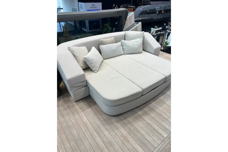  Yacht Photos Pics Luxurious seating area on 2022 Explorer 62 yacht, featuring plush cushions and elegant design.