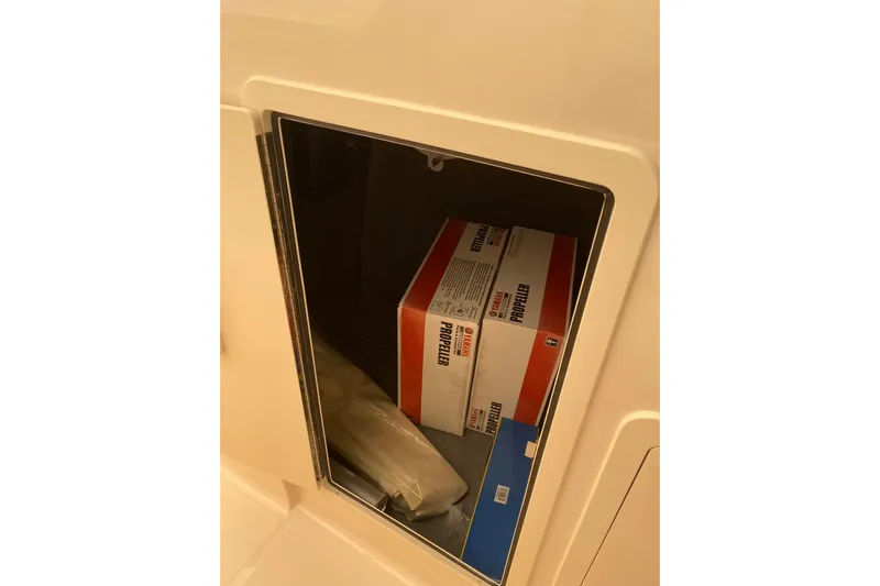  Yacht Photos Pics Storage compartment on 2026 Grady-White Freedom 307 boat with Yamaha propeller boxes.