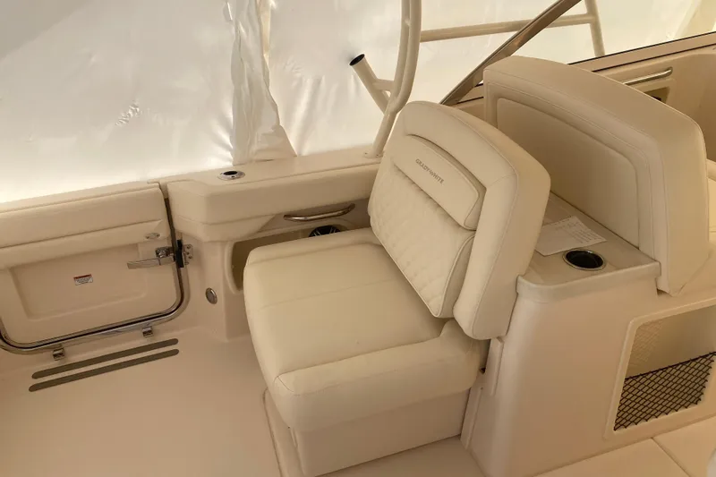  Yacht Photos Pics 2026 Grady-White Freedom 307 boat interior with beige seating and cup holder.