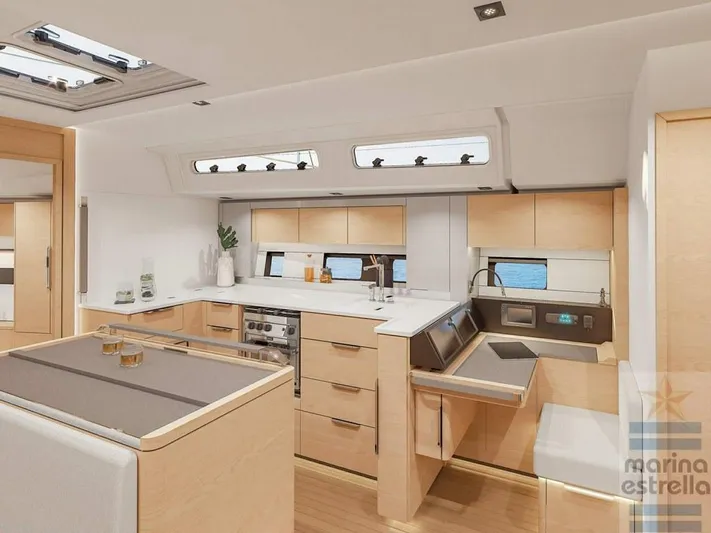  Yacht Photos Pics Luxurious interior of 2022 Hanse 510 yacht with modern kitchen design.