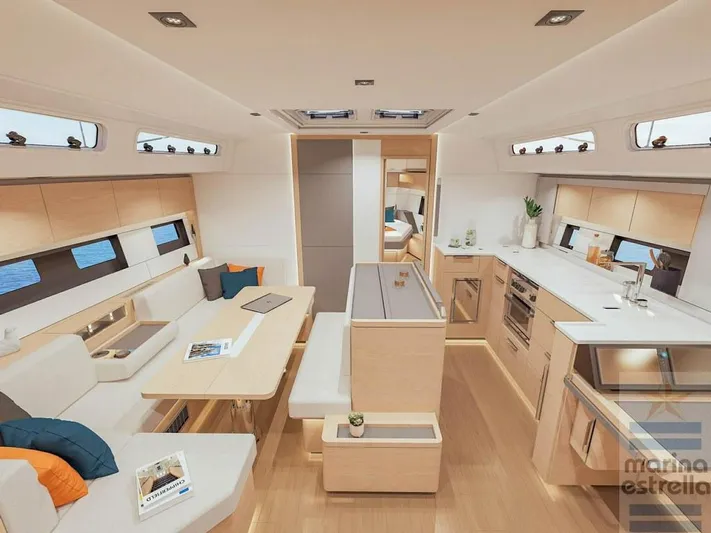 Yacht Photos Pics Luxurious interior of 2022 Hanse 510 yacht with modern kitchen and seating area.