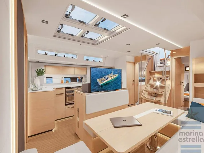  Yacht Photos Pics Luxurious interior of 2022 Hanse 510 yacht with modern kitchen and seating area.