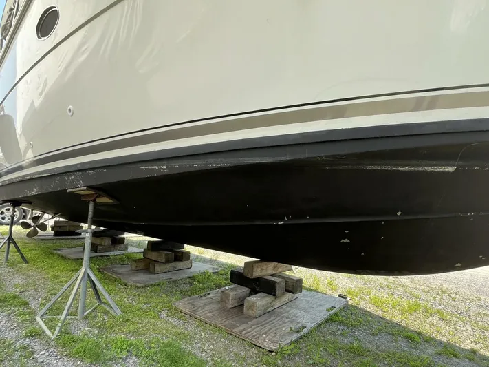  Yacht Photos Pics 1996 Carver 370 Aft Cabin boat hull on supports, displayed outdoors.