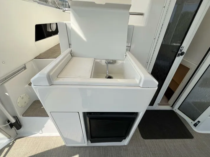  Yacht Photos Pics 1996 Carver 370 Aft Cabin yacht kitchenette with sink and mini fridge.