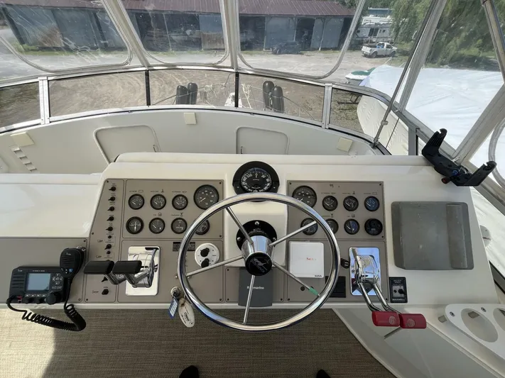  Yacht Photos Pics 1996 Carver 370 Aft Cabin helm with steering wheel, gauges, and controls.