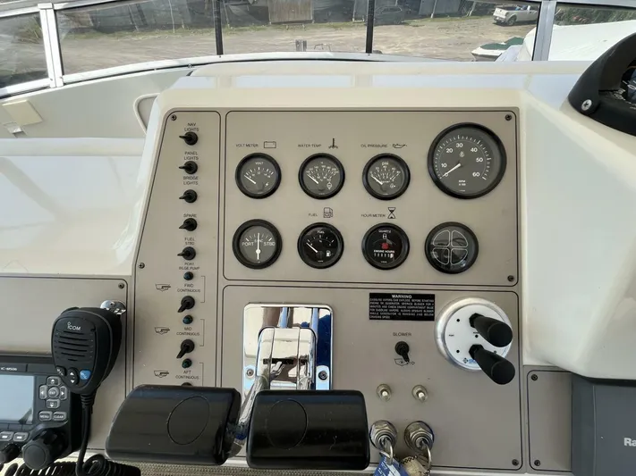  Yacht Photos Pics Control panel of a 1996 Carver 370 Aft Cabin boat with gauges and switches.