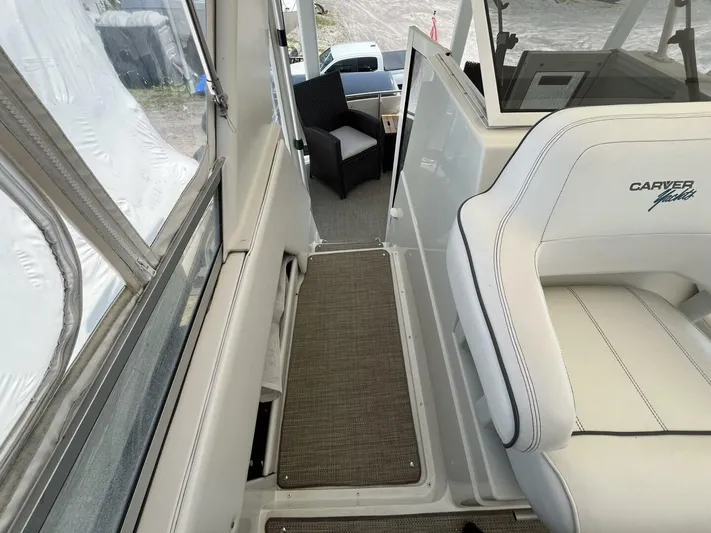  Yacht Photos Pics 1996 Carver 370 Aft Cabin interior with white seating and outdoor view.