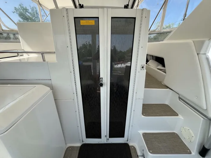  Yacht Photos Pics 1996 Carver 370 Aft Cabin interior with steps and door, showcasing sleek design.