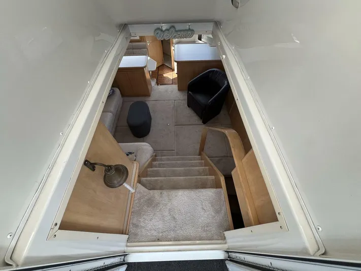  Yacht Photos Pics Interior view of 1996 Carver 370 Aft Cabin, featuring stairs and cozy seating area.