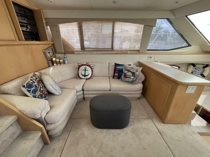  Yacht Photos Pics 1996 Carver 370 Aft Cabin interior with cozy seating and nautical-themed decor.