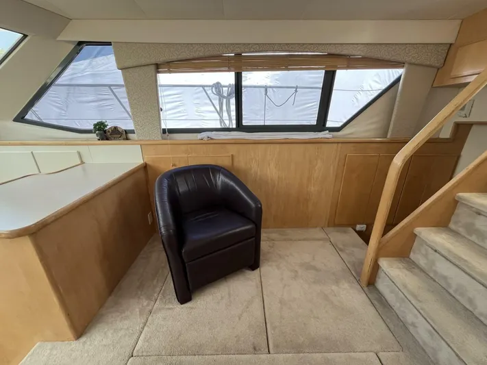  Yacht Photos Pics Interior of 1996 Carver 370 Aft Cabin with leather chair and wooden accents.