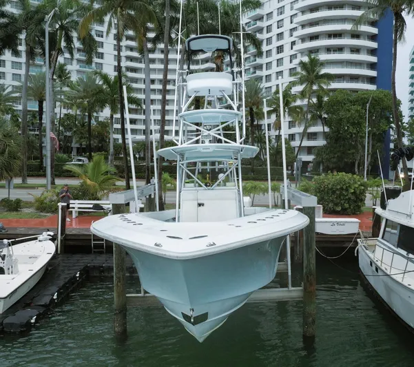  Yacht Photos Pics 2017 SeaVee Z 39 boat docked in marina with palm trees and buildings in background.