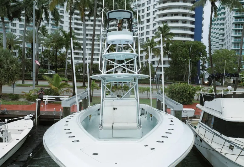  Yacht Photos Pics 2017 SeaVee Z 39 boat docked in marina, surrounded by palm trees and modern buildings.