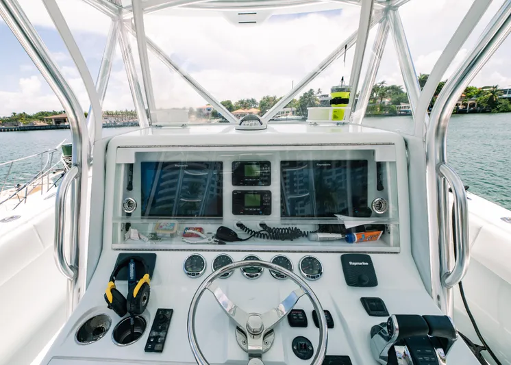  Yacht Photos Pics 2017 SeaVee Z 39 boat dashboard with navigation controls and steering wheel.