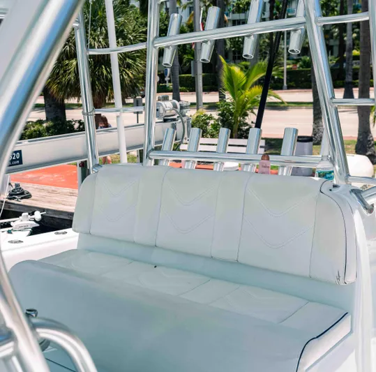  Yacht Photos Pics 2017 SeaVee Z 39 boat with white seating and rod holders, docked near palm trees.