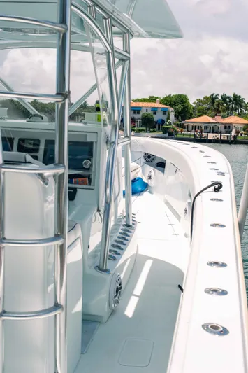  Yacht Photos Pics 2017 SeaVee Z 39 boat with sleek design and modern controls docked by waterfront homes.