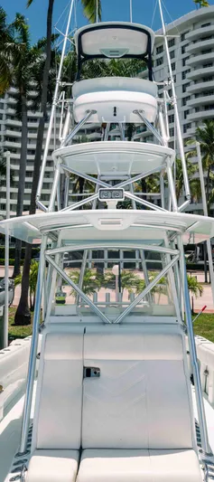  Yacht Photos Pics 2017 SeaVee Z 39 boat with tower, docked near palm trees and buildings.