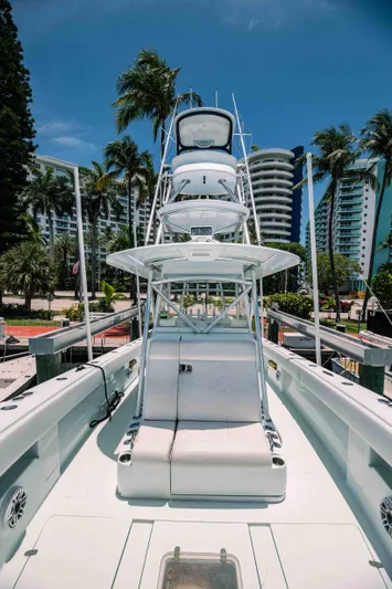  Yacht Photos Pics 2017 SeaVee Z 39 boat docked, surrounded by palm trees and modern buildings.