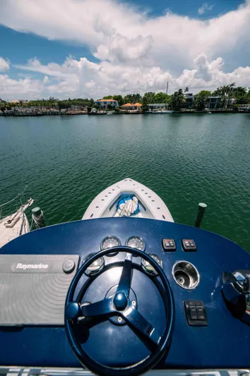  Yacht Photos Pics 2017 SeaVee Z 39 boat helm with scenic waterfront view.