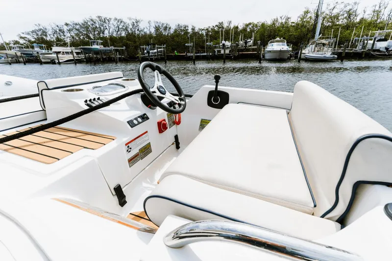Live More Yacht Photos Pics Galeon 680 Fly 2021 yacht helm with white seating and water view.