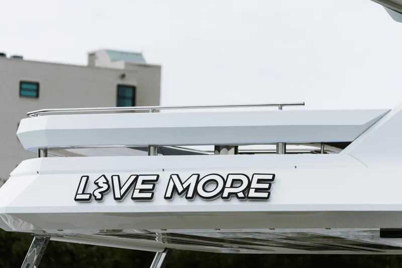 Live More Yacht Photos Pics Galeon 680 Fly 2021 yacht with "Live More" text on the side.