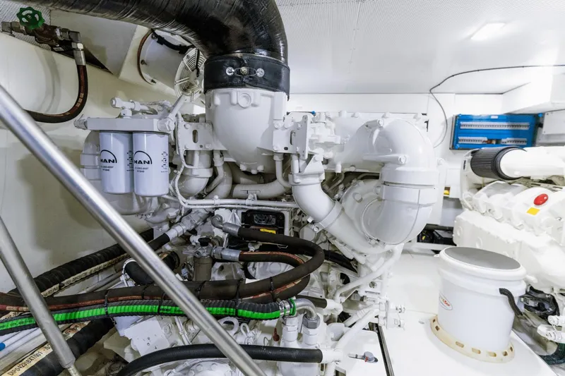 Live More Yacht Photos Pics Engine room of 2021 Galeon 680 Fly yacht, featuring MAN components and intricate piping.