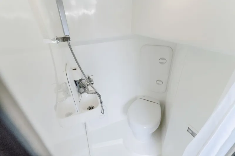 Live More Yacht Photos Pics Modern bathroom in 2021 Galeon 680 Fly yacht, featuring sleek fixtures and compact design.