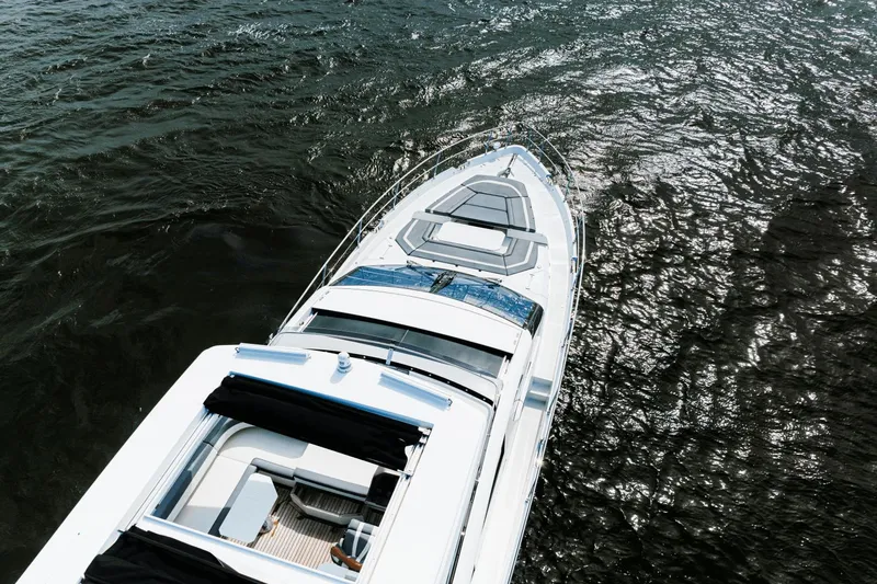Live More Yacht Photos Pics Aerial view of 2021 Galeon 680 Fly yacht cruising on open water.