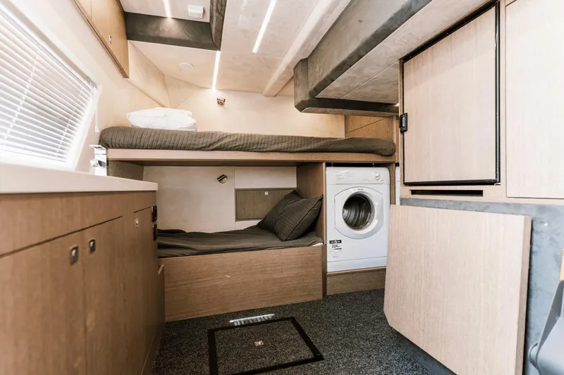 Live More Yacht Photos Pics Interior of 2021 Galeon 680 Fly yacht with bunk beds and washing machine.
