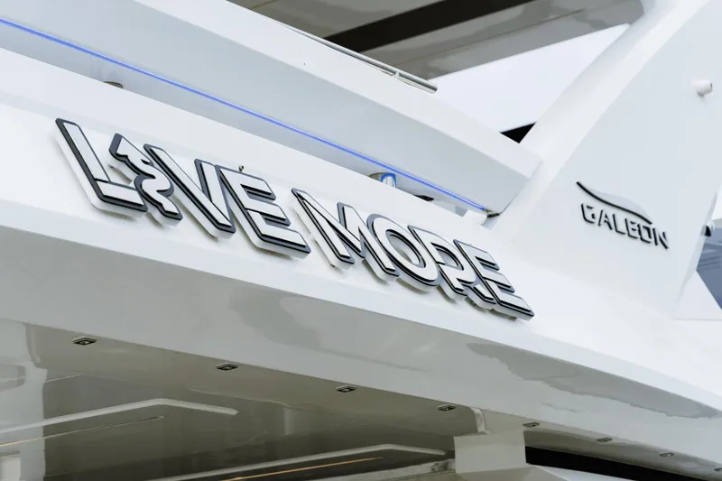 Live More Yacht Photos Pics Galeon 680 Fly 2021 yacht with "Live More" lettering on the side.