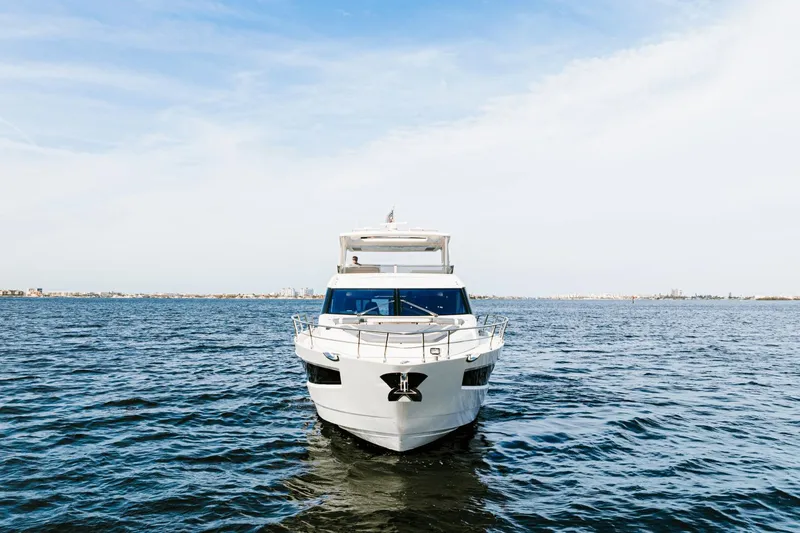Live More Yacht Photos Pics 2021 Galeon 680 Fly yacht on open water under clear sky.