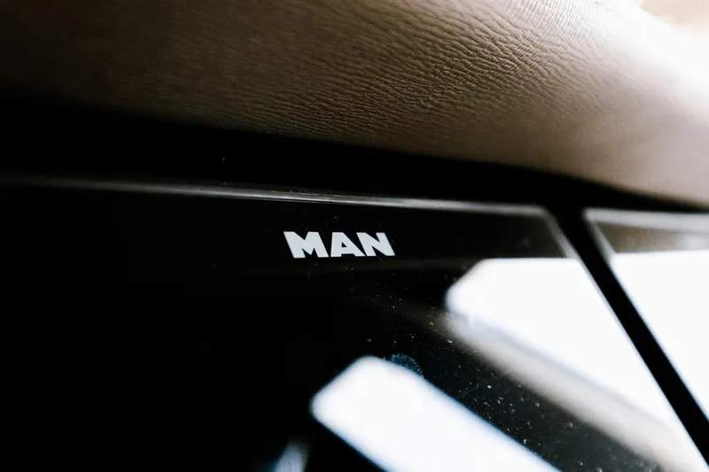 Live More Yacht Photos Pics Close-up of MAN logo on 2021 Galeon 680 Fly yacht dashboard.