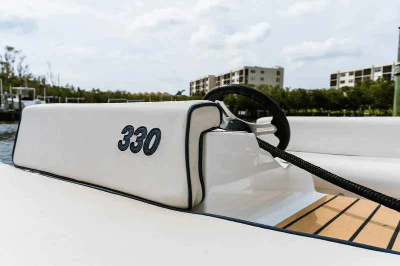 Live More Yacht Photos Pics Galeon 680 Fly 2021 boat interior with steering wheel and "330" marking.