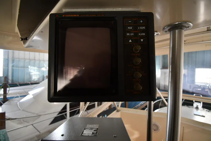 Stormy Yacht Photos Pics Vintage monitor on 1988 Viking 48 Convertible yacht, displaying control panel and buttons.