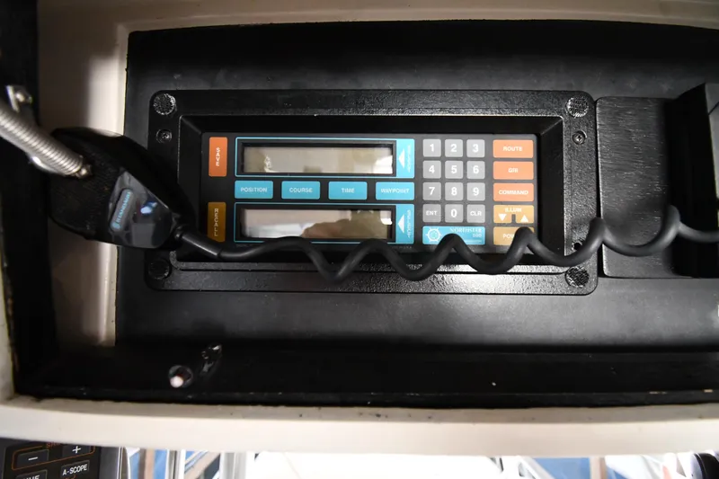 Stormy Yacht Photos Pics Control panel of a 1988 Viking 48 Convertible boat with microphone and keypad.