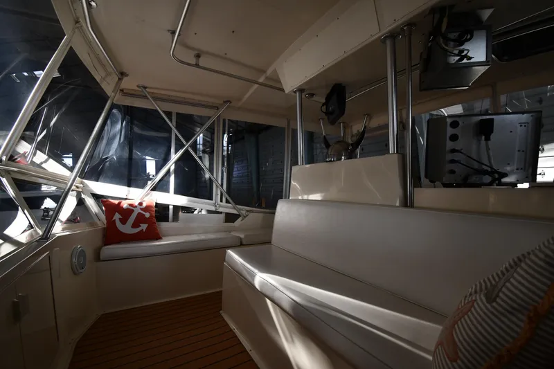 Stormy Yacht Photos Pics Interior of 1988 Viking 48 Convertible yacht with seating and nautical decor.