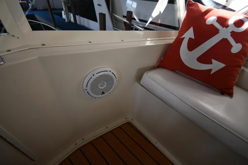 Stormy Yacht Photos Pics Interior of 1988 Viking 48 Convertible with anchor-themed pillow and speaker.
