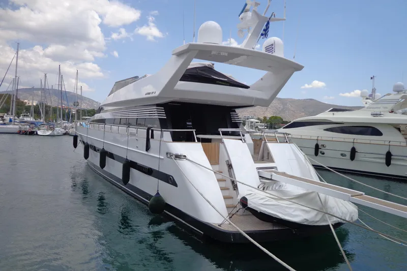 Galini Yacht Photos Pics Luxury yacht Cantieri di Pisa 27s, 2001 model, docked in a marina with clear skies.