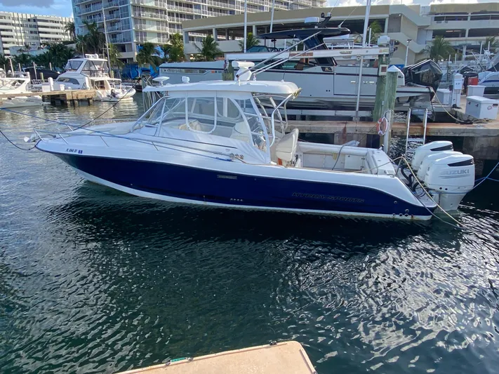  Yacht Photos Pics 2006 Hydra-Sports Vector 3300 VX boat docked at marina with twin Suzuki engines.