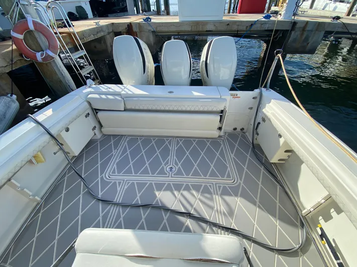  Yacht Photos Pics 2006 Hydra-Sports Vector 3300 VX boat interior with triple outboard engines at dock.