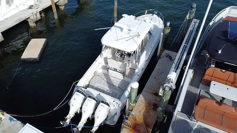  Yacht Photos Pics 2006 Hydra-Sports Vector 3300 VX boat docked with triple outboard engines.