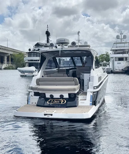 O-sea-d Yacht Photos Pics 2015 Regal 35 Sport Coupe yacht docked in a marina, rear view.