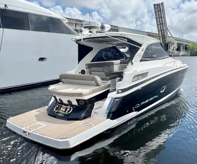 O-sea-d Yacht Photos Pics 2015 Regal 35 Sport Coupe yacht docked, featuring sleek design and spacious seating.