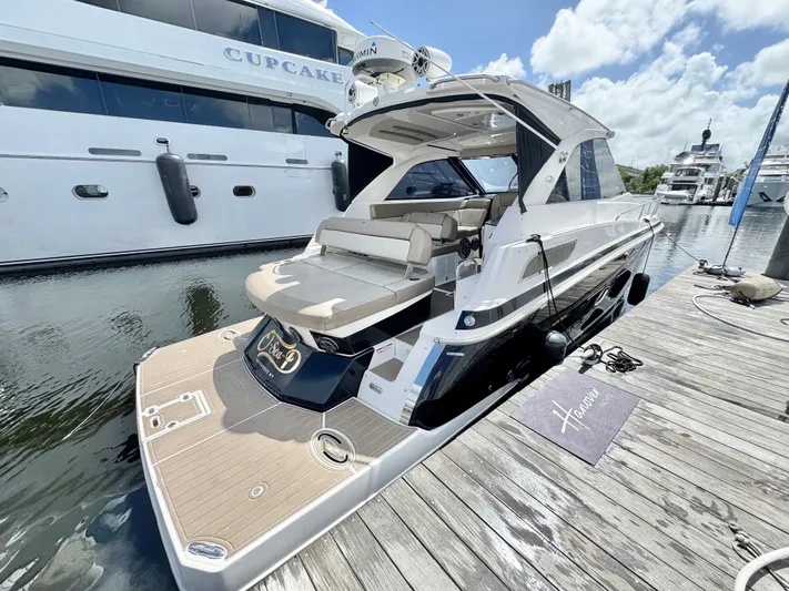 O-sea-d Yacht Photos Pics 2015 Regal 35 Sport Coupe docked at marina, featuring sleek design and spacious deck.