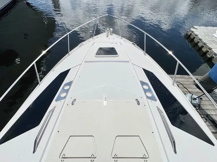 O-sea-d Yacht Photos Pics 2015 Regal 35 Sport Coupe boat deck view at marina.