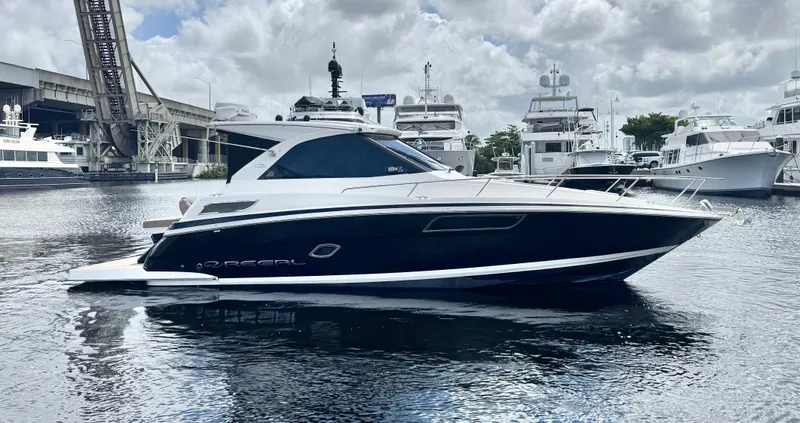 O-sea-d Yacht Photos Pics 2015 Regal 35 Sport Coupe yacht docked in a marina, surrounded by other boats.