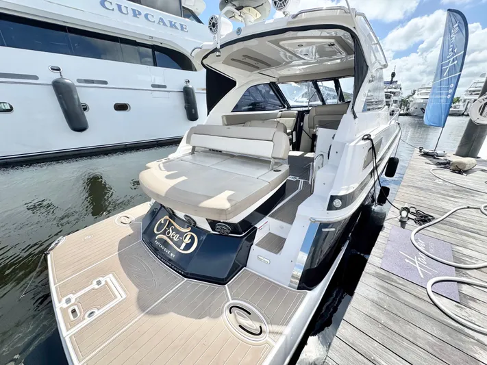 O-sea-d Yacht Photos Pics 2015 Regal 35 Sport Coupe yacht docked, featuring spacious seating and sleek design.